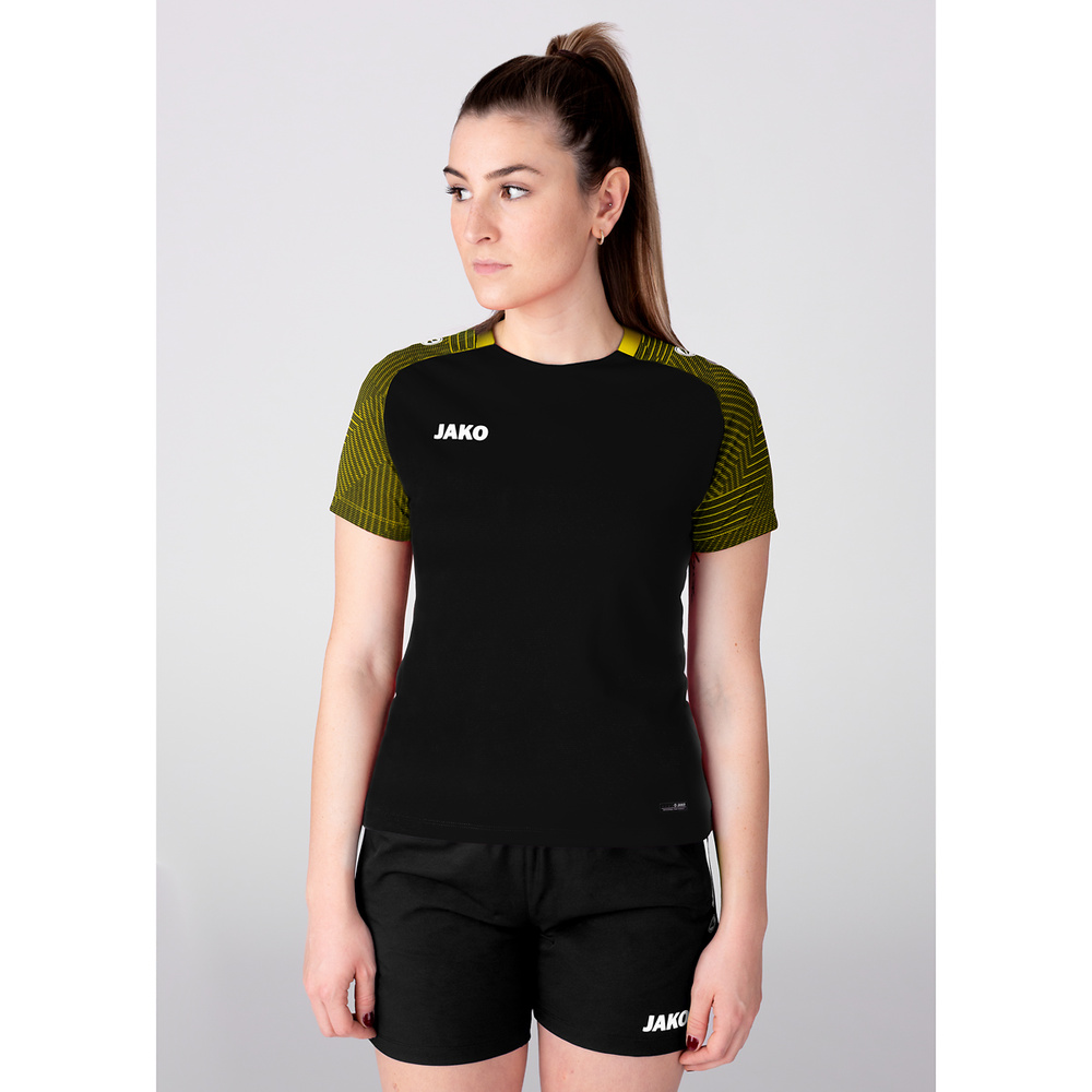 CAMISETA JAKO PERFORMANCE, NEGRA-AMARILLA MUJER. 