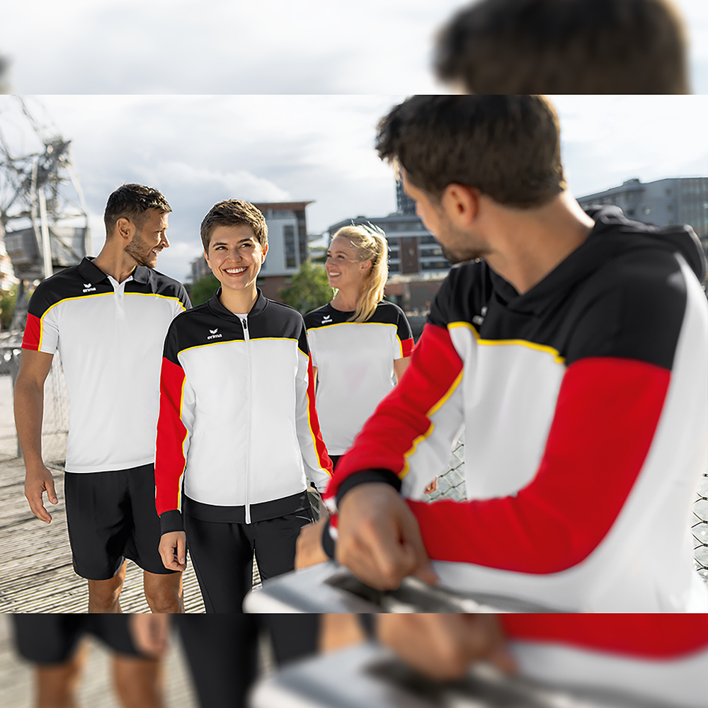 CHAQUETA ENTRENAMIENTO CON CAPUCHA ERIMA CHANGE, BLANCA-NEGRA-ROJA MUJER. 