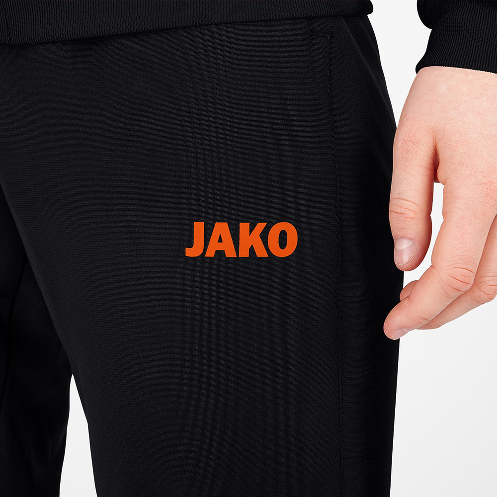 PANTALÓN POLIÉSTER JAKO CHALLENGE, NEGRO-NARANJA NEÓN MUJER. 