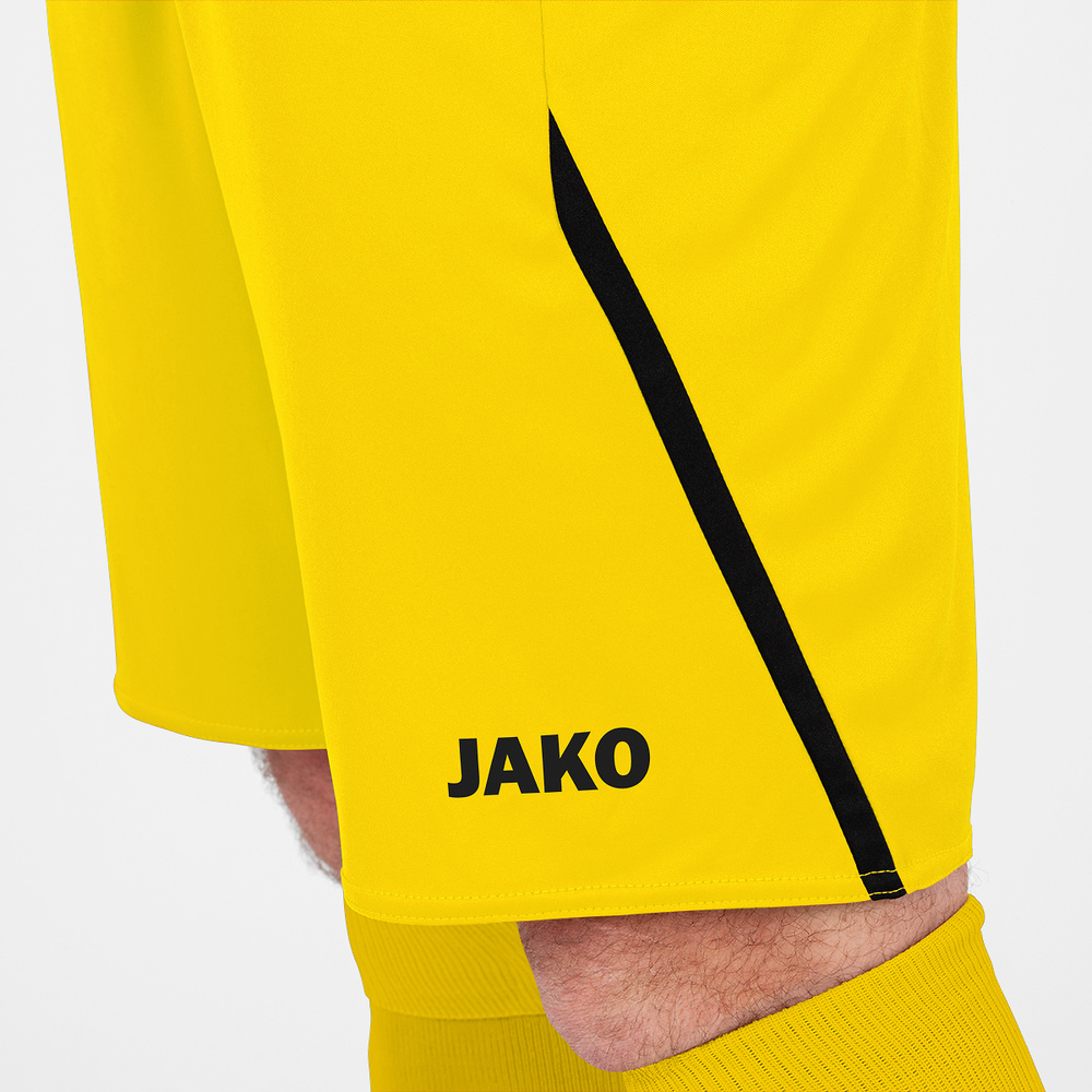 SHORT JAKO CHALLENGE, AMARILLO-NEGRO HOMBRE. 